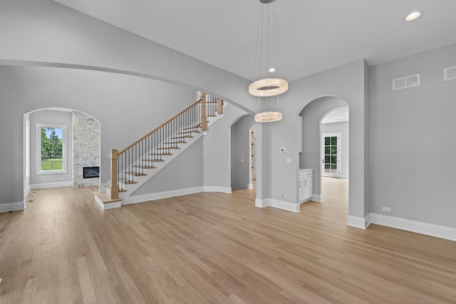7213 Daybreak Ln, Long Grove, IL 60060 - foyer with plenty of natural light, light wood finished floors, a fireplace, and recessed lighting