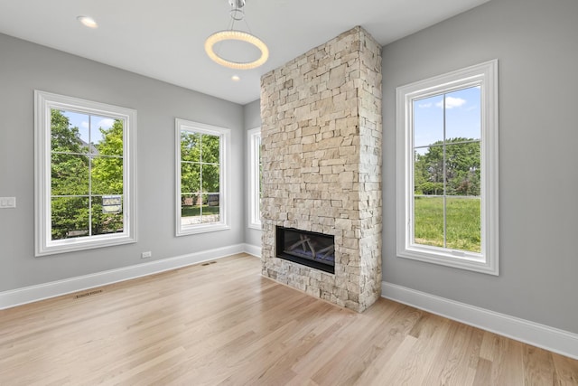 7213 Daybreak Ln, Long Grove, IL 60060 - unfurnished living room featuring baseboards, wood finished floors, and a fireplace