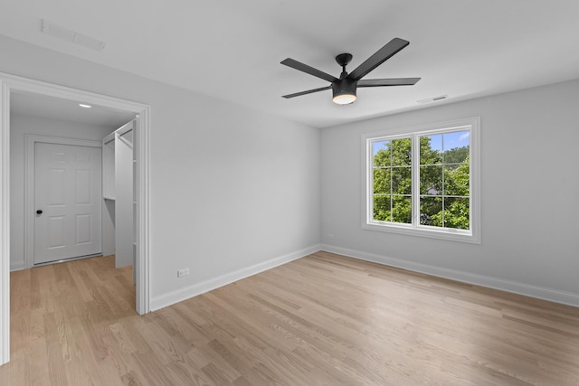 7213 Daybreak Ln, Long Grove, IL 60060 - spare room featuring light wood-type flooring, baseboards, and a ceiling fan