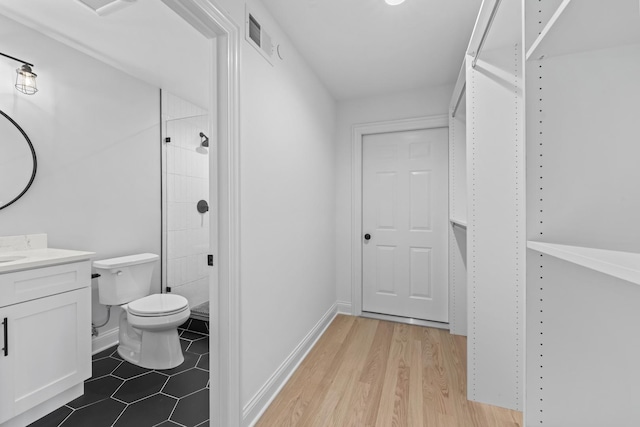 7213 Daybreak Ln, Long Grove, IL 60060 - full bath with vanity, tiled shower, toilet, and wood finished floors