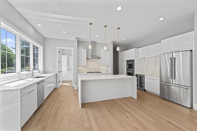7213 Daybreak Ln, Long Grove, IL 60060 - kitchen with appliances with stainless steel finishes, modern cabinets, a sink, wall chimney range hood, and beverage cooler