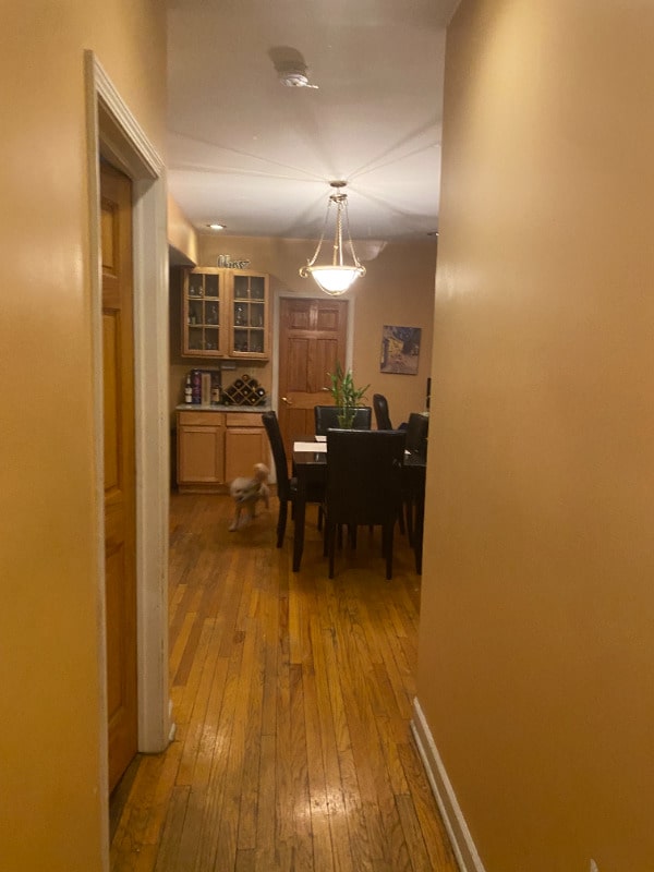 7308 S Yates Blvd Unit 1, Chicago, IL 60649 - dining room with hardwood / wood-style floors and a notable chandelier