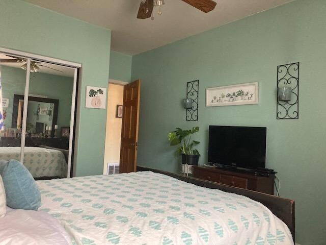 7308 S Yates Blvd Unit 1, Chicago, IL 60649 - bedroom featuring a ceiling fan and a closet