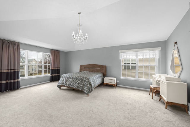 bedroom featuring baseboards, vaulted ceiling, carpet flooring, and a chandelier