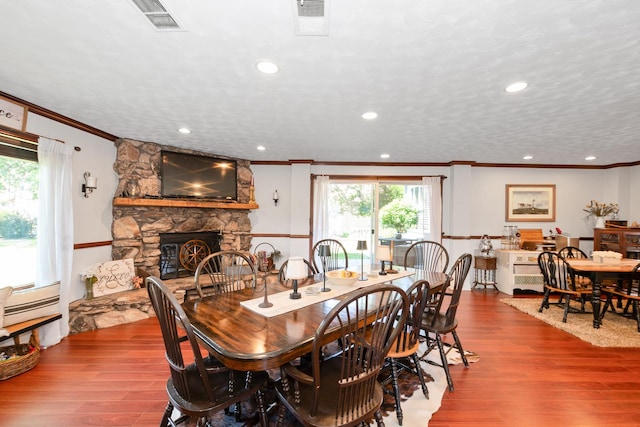 9201 175th St, Tinley Park, IL 60487 - dining area with crown molding, a stone fireplace, wood finished floors, and recessed lighting