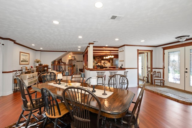 9201 175th St, Tinley Park, IL 60487 - dining room featuring wood finished floors, french doors, ornamental molding, recessed lighting, and bar area
