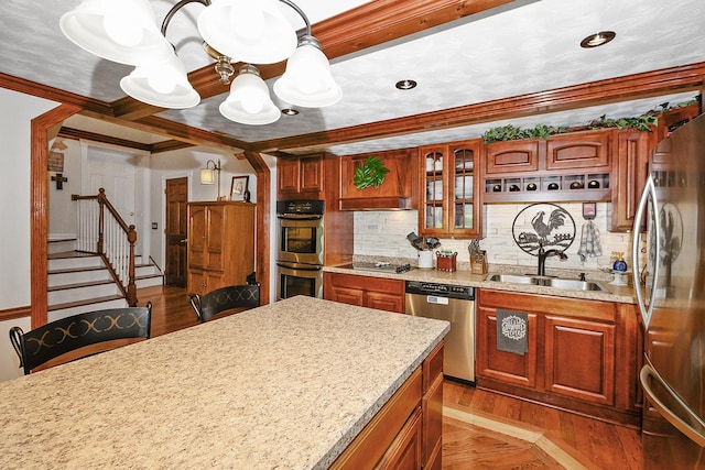 9201 175th St, Tinley Park, IL 60487 - kitchen featuring stainless steel appliances, a chandelier, tasteful backsplash, ornamental molding, and wood finished floors