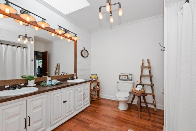 9201 175th St, Tinley Park, IL 60487 - full bath featuring crown molding, a skylight, wood finished floors, double vanity, and a shower with shower curtain