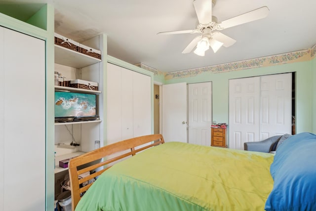 bedroom with two closets and ceiling fan