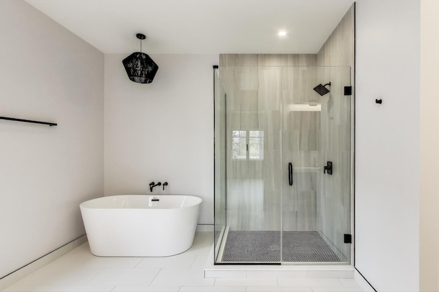 7302 Ponto Ct, Morton Grove, IL 60053 - bathroom featuring a stall shower, a soaking tub, tile patterned floors, and recessed lighting