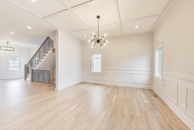 7302 Ponto Ct, Morton Grove, IL 60053 - unfurnished dining area with a chandelier, light wood-type flooring, recessed lighting, a decorative wall, and coffered ceiling