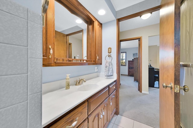 bathroom with tile patterned floors and vanity