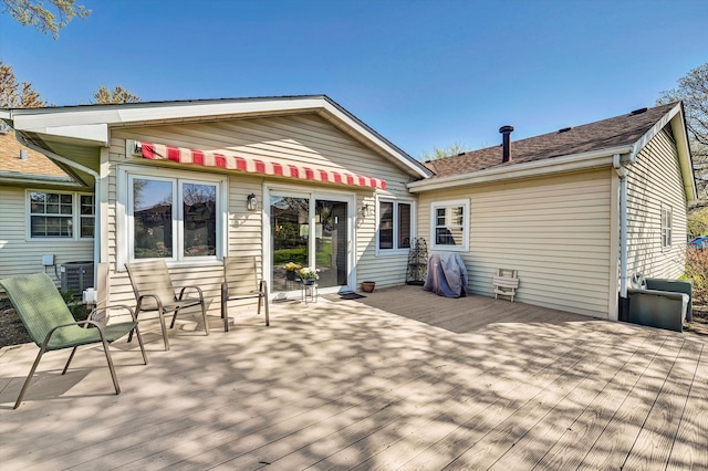 rear view of property with a deck