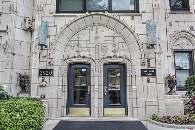 entrance to property with stone siding