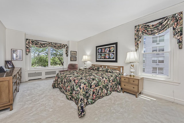 bedroom featuring baseboards and carpet