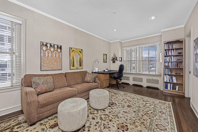 interior space featuring crown molding, wood finished floors, and recessed lighting