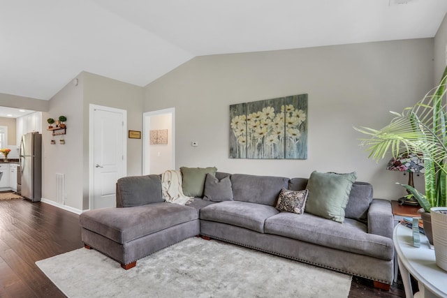 104 E Winchester Rd Unit E, Libertyville, IL 60048 - living area featuring dark wood-style floors, vaulted ceiling, and baseboards