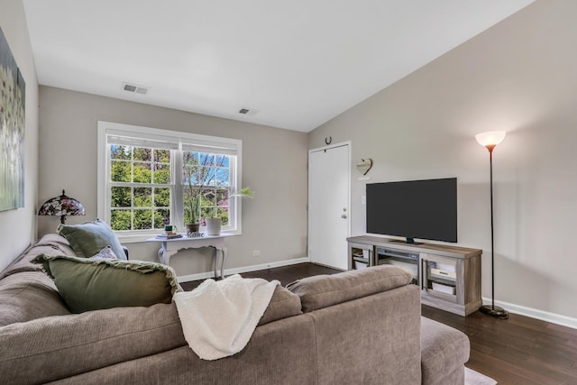 104 E Winchester Rd Unit E, Libertyville, IL 60048 - living area with dark wood-style floors and baseboards