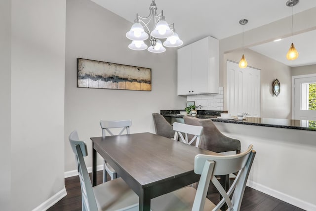 104 E Winchester Rd Unit E, Libertyville, IL 60048 - dining room featuring dark wood-style floors, a chandelier, and baseboards