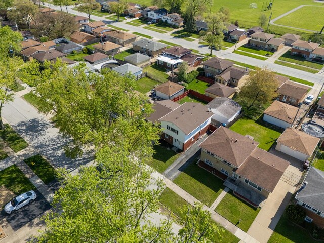 aerial view of property's location with nearby suburban area