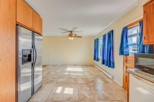 kitchen featuring stainless steel refrigerator with ice dispenser, baseboard heating, ceiling fan, dishwasher, and light countertops