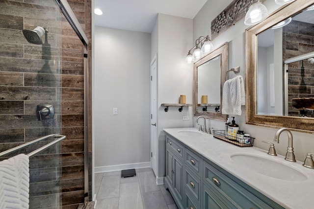 full bathroom with tile patterned flooring, a sink, double vanity, and a stall shower