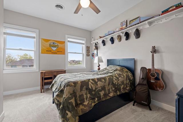 bedroom with ceiling fan, baseboards, carpet flooring, and visible vents