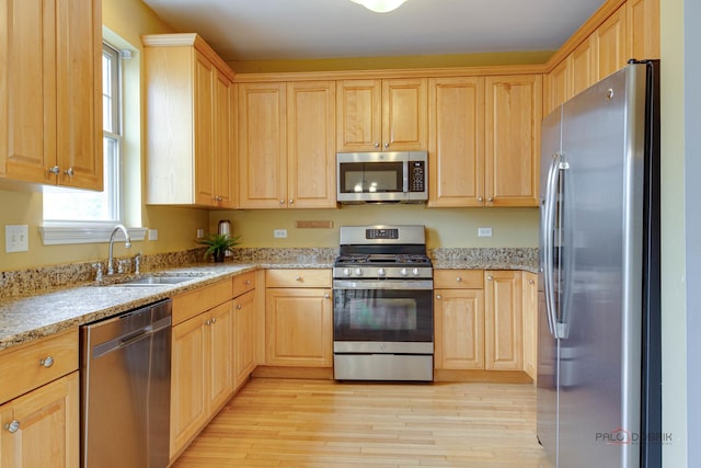 1123 E Port Clinton Rd, Vernon Hills, IL 60061 - kitchen with appliances with stainless steel finishes, light brown cabinets, a sink, and light wood-style flooring