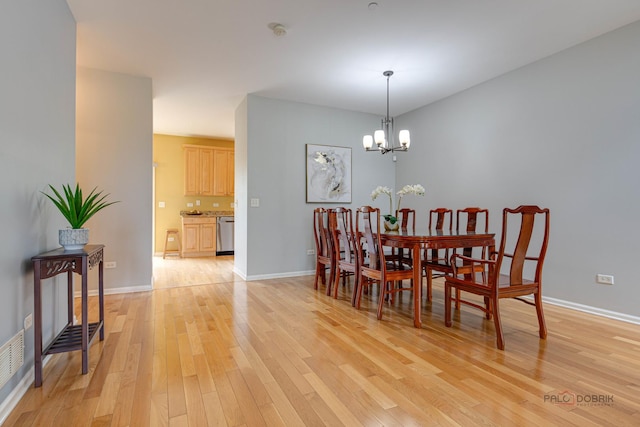 1123 E Port Clinton Rd, Vernon Hills, IL 60061 - dining area with light wood-style floors, a chandelier, and baseboards