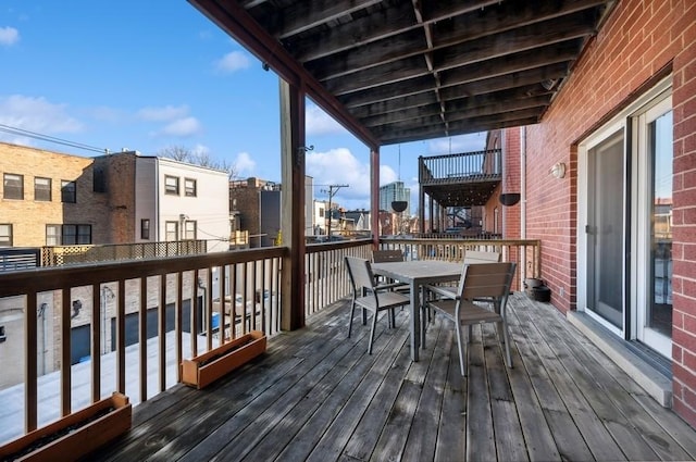 wooden deck with outdoor dining space