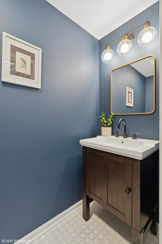 bathroom with vanity and baseboards