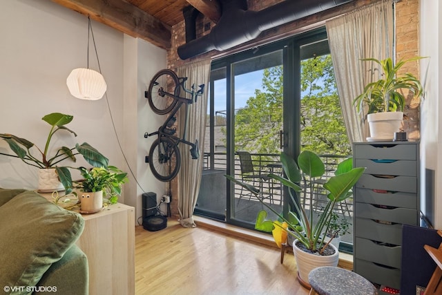 entryway with beamed ceiling, wood finished floors, and wooden ceiling