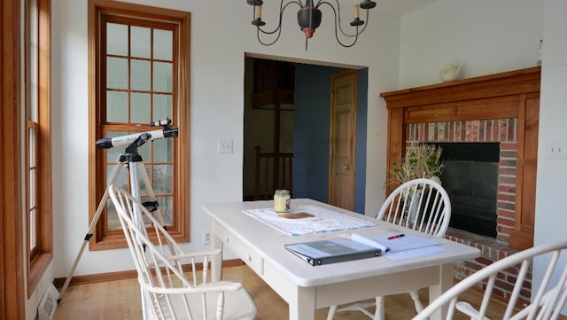 2346 W Longhollow Rd, Elizabeth, IL 61028 - dining room featuring a chandelier and light wood finished floors