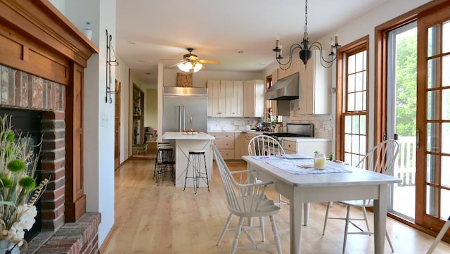 2346 W Longhollow Rd, Elizabeth, IL 61028 - dining area featuring ceiling fan and light wood-style floors