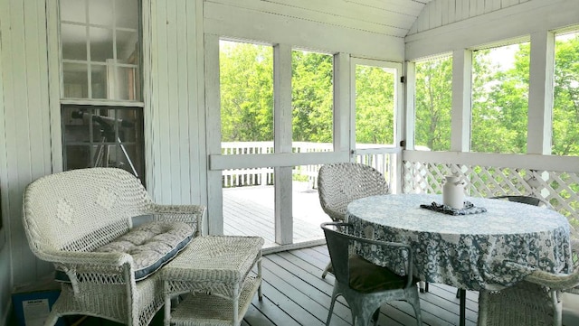 2346 W Longhollow Rd, Elizabeth, IL 61028 - sunroom / solarium with lofted ceiling and outdoor dining area