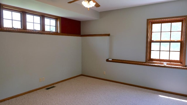 2346 W Longhollow Rd, Elizabeth, IL 61028 - empty room featuring ceiling fan, light colored carpet, and baseboards