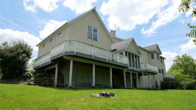 2346 W Longhollow Rd, Elizabeth, IL 61028 - rear view of property with a yard, a wooden deck, and a chimney