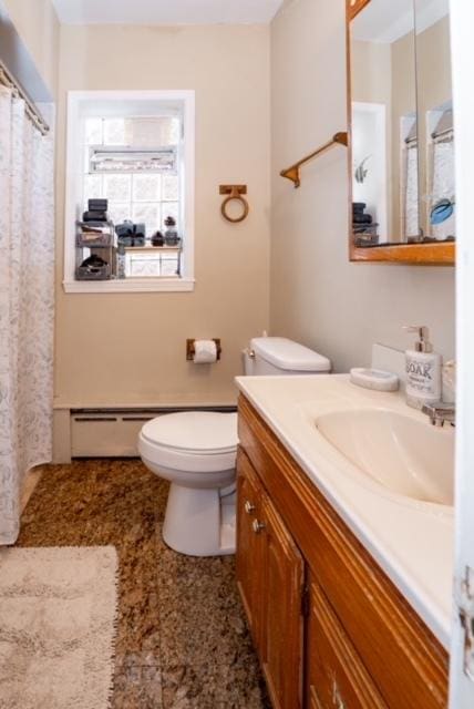 full bathroom featuring toilet, a baseboard radiator, a shower with shower curtain, and vanity