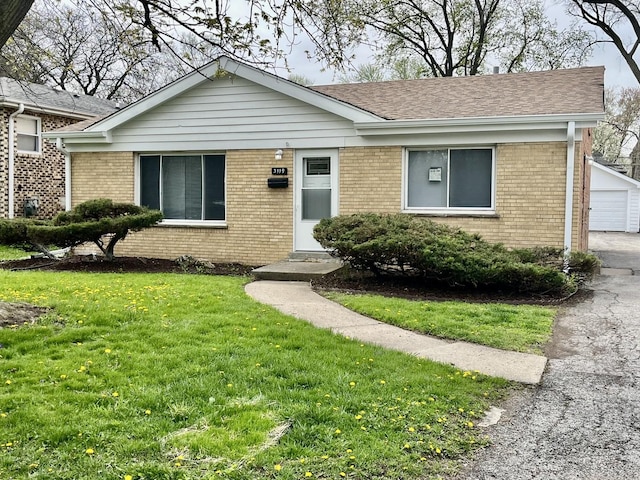 3119 W 172nd St, Hazel Crest, IL 60429 - single story home with brick siding, a front yard, a detached garage, and an outdoor structure