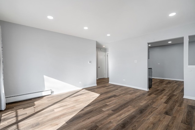 215 S Hale St Unit 9B, Addison, IL 60101 - spare room featuring a baseboard heating unit, dark wood finished floors, and recessed lighting