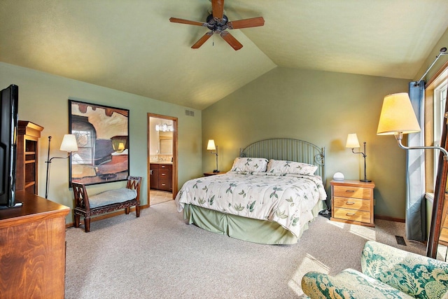 carpeted bedroom with a ceiling fan, visible vents, vaulted ceiling, and ensuite bathroom