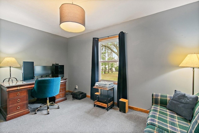office area featuring baseboards and light colored carpet