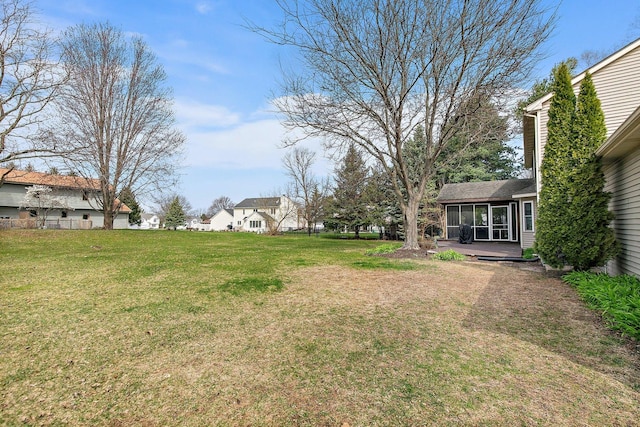 view of yard featuring a sunroom