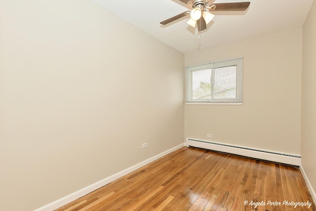 unfurnished room featuring baseboards, a ceiling fan, light wood finished floors, and baseboard heating