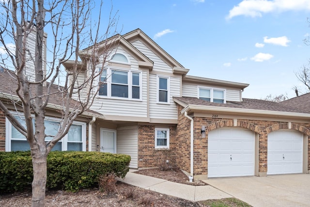 view of front of property with brick siding and concrete driveway