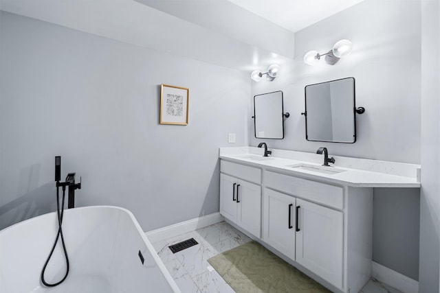 bathroom featuring visible vents, baseboards, marble finish floor, and a sink