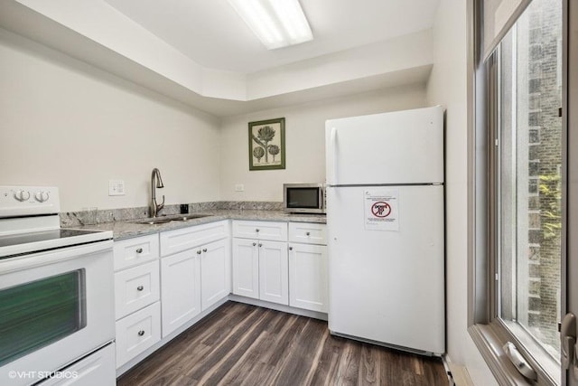 1250 Rudolph Rd Unit 5B, Northbrook, IL 60062 - kitchen with white appliances, a sink, dark wood-type flooring, white cabinets, and light stone countertops