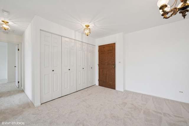 1250 Rudolph Rd Unit 5B, Northbrook, IL 60062 - unfurnished bedroom featuring a chandelier, carpet flooring, and a closet