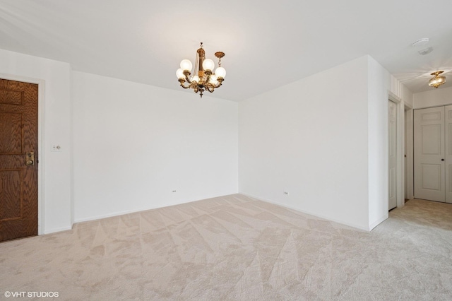 1250 Rudolph Rd Unit 5B, Northbrook, IL 60062 - unfurnished room featuring carpet floors, a chandelier, and baseboards