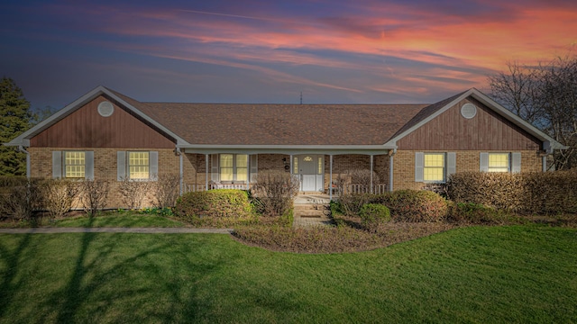 39935 N Prairie View Dr, Wadsworth, IL 60083 - ranch-style house featuring brick siding, a front lawn, and covered porch